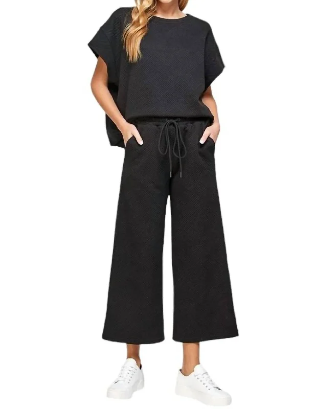 Textured Short Sleeve And Cropped Flare Pant Set In Black